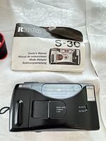 Ricoh S-30 camera front with manual and case