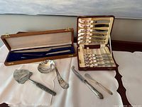 All pieces displayed including both cases and loose serving utensils