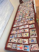 Wide view of entire spread of Topps baseball cards laid out on table