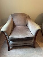 Front view of upholstered club armchair showing overall design and condition