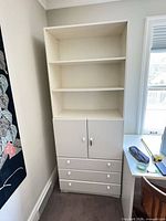Full front view of bookshelf showing open shelving, cabinet, and drawers