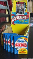 Front view showing display box and five sealed packs