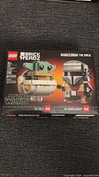 Front of sealed LEGO BrickHeadz 75317 box showing characters and piece count