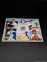 Overall view of Heroes of Baseball print showing player illustrations and event logo
