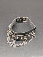 Full view of collar showing studs, chains and overall design