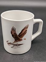 front view of white mug showing bald eagle graphic