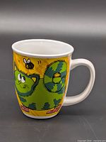 Side view showing green striped cartoon cat graphic on yellow background