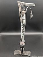 Full view of CCM floor bicycle pump showing barrel, handle, hose, base