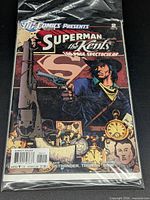 Front cover in protective sleeve showing title, issue number, price, rating