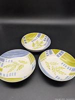All three matching hand-painted bowls, top view