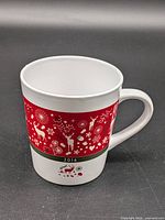 Front view of mug showing red festive band and 2016 date