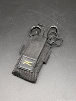 pouch closed with visible PakCan logo, instruments partially visible