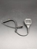Full view of Motorola remote speaker microphone with coiled cord