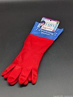 Full view of red latex gloves with tag