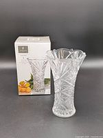 Vase displayed beside original box