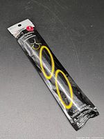 Front view of sealed Celebrate! glow necklaces package