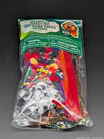 Front view of sealed craft kit showing contents through clear packaging