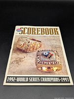 Front cover showing title, rings image and championship years