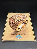 Front cover featuring championship ring image