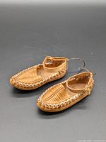 pair of tan leather moccasins top view