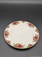 Top view of Royal Albert 10.5" Old Country Roses dinner plate showing pattern and gold rim