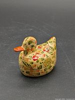 Full view of duck-shaped box showing painted details