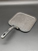 Top view of square ridged grill pan with handle