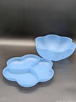 Blue Tupperware five-petal bowl and matching three-section tray lid