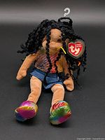 Full view of Ty Jazzy Jessie plush doll with hang tag