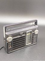 Front view of Sony TFM-7150W showing speaker grille, tuning scale and controls