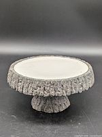 Full view of pedestal cake plate showing bark texture and white top