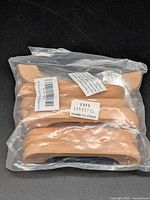 Sealed bag containing eight wooden handles
