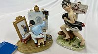 Both figurines side by side showing overall form and colour