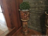 Full view of the ceramic jardiniere and pedestal vase with artificial topiary plants, showing the height and shape.