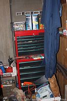 Full view of Husky red tool chest set with items around