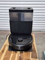 Robot vacuum docked on AutoWash station