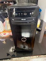 Front view showing ASUS optical drive, USB 3.0 ports, power button