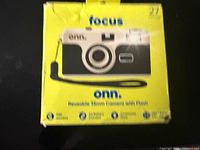 Front of yellow retail box showing camera image and branding