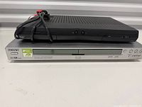 Front view showing Sony DVD player and Bell ExpressVu receiver stacked