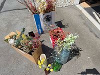 Group shot of all artificial stems, vases, bottles, boxes and bucket