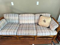 Front view of sofa showing cushions and pillow