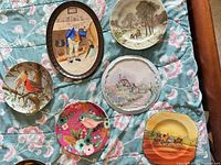 Group shot of all six plates on quilt