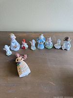Group shot of nine angel figurines