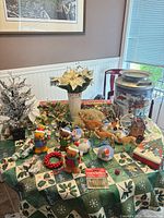overview of mixed Christmas decorations on table