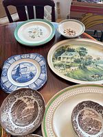 Top view showing assorted plates, bowls and two oval platters