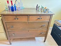 Front view of dresser showing drawers and hardware