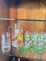 Pitcher, floral tumblers, green cups, clear textured tumbler