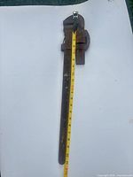 Full view of 24-inch pipe wrench with tape measure