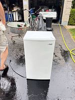 Front view of Arctic King white mini fridge