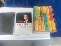 Group shot of Frank McKenna biography, The Enforcer spine and six-volume religion boxed set